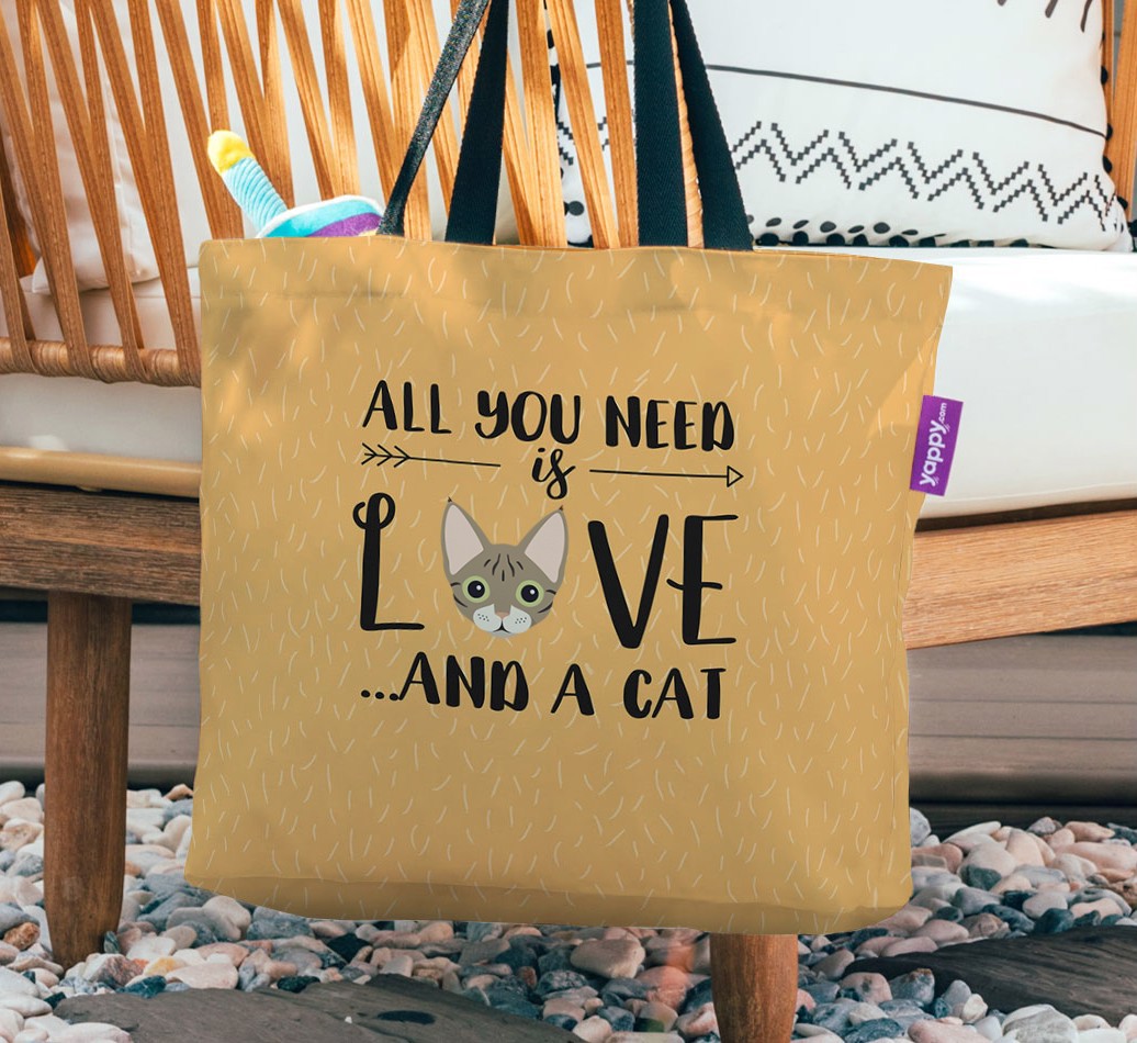 All You Need Is Love: Personalized Canvas Bag with {breedFullName} Icon - hanging on a chair