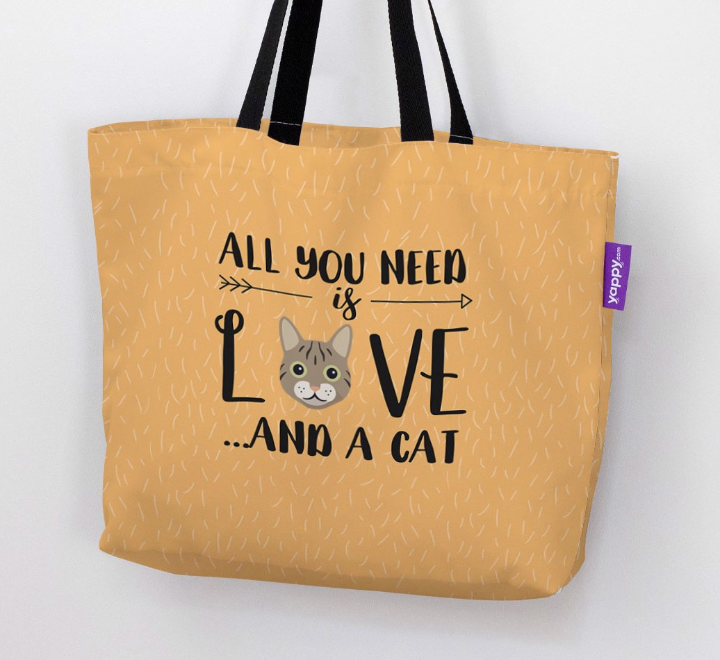 Woman holding 'All You Need Is Love...' Canvas Bag with {breedFullName} Icon