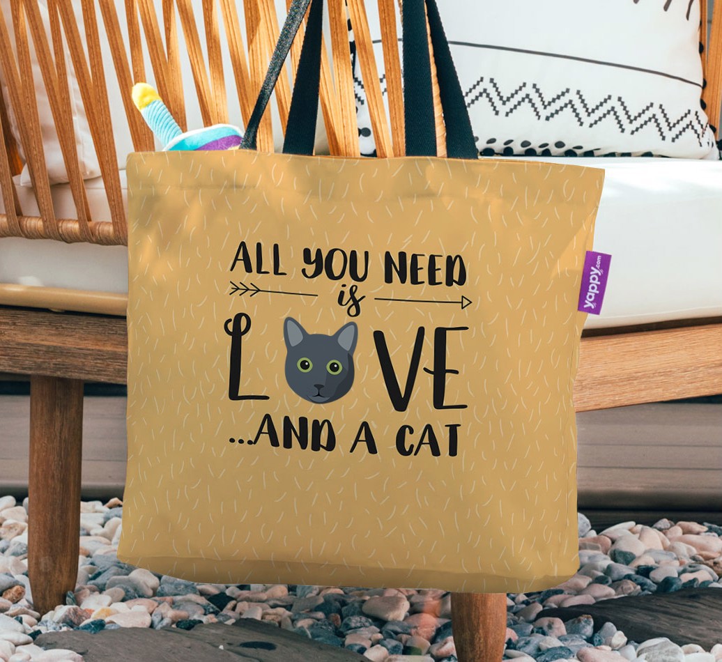 All You Need Is Love: Personalized Canvas Bag with {breedFullName} Icon - hanging on a chair