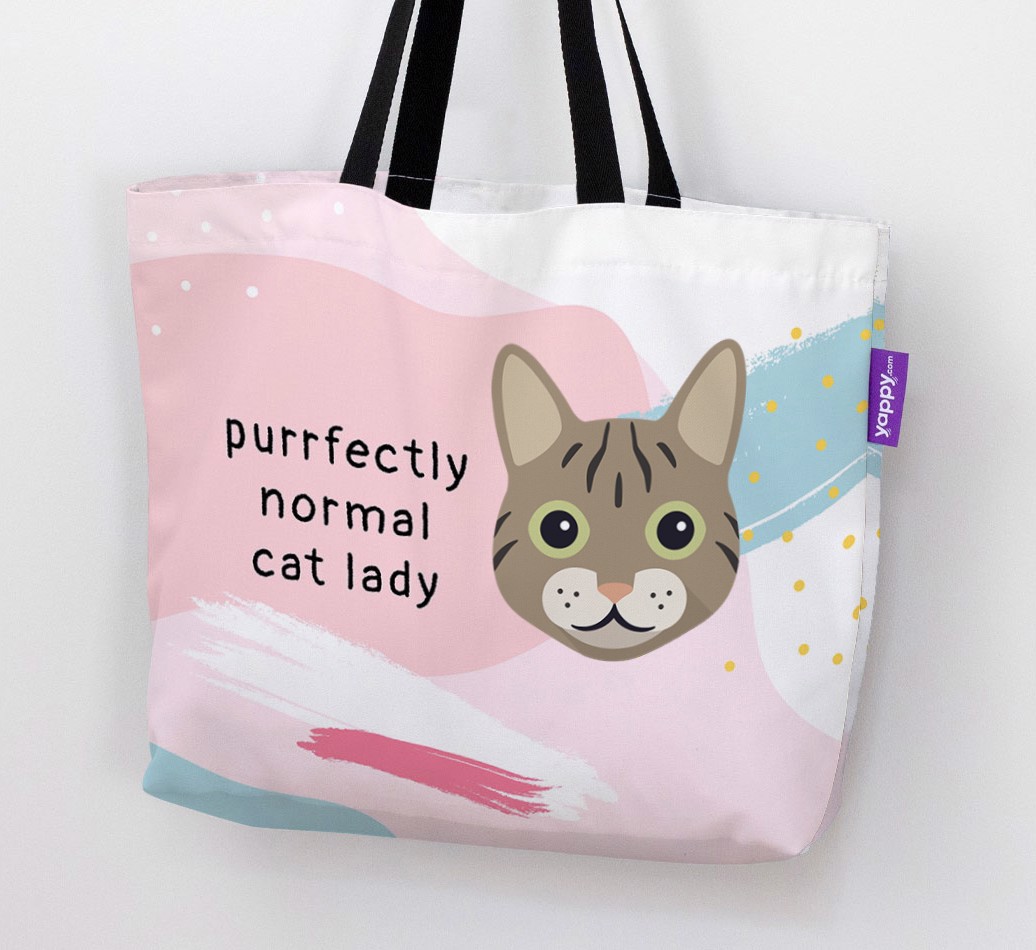 Woman holding 'Purrfectly Normal Cat Lady' Canvas Bag
