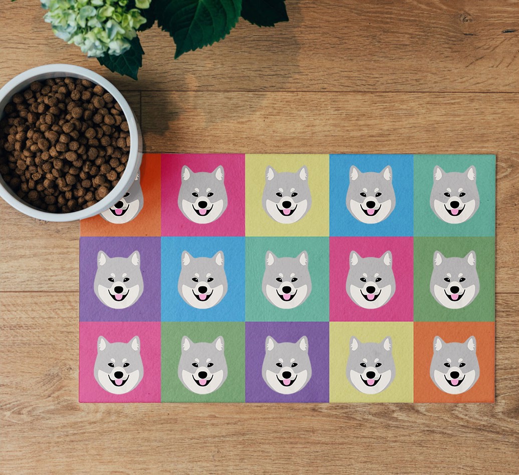 'Icon Pattern' Feeding Mat - flatlay on wooden floor with bowl