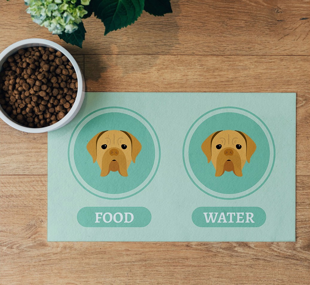 'Yappicons' Feeding Mat - flatlay on wooden floor with bowl