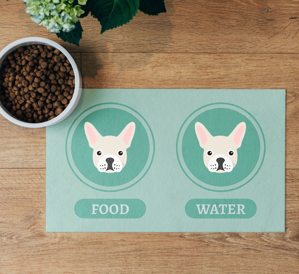 'Yappicons' Feeding Mat - flatlay on wooden floor with bowl