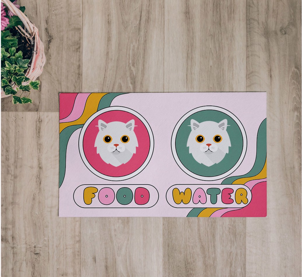 'Rainbow Icons' Feeding Mat - flatlay on wooden floor with bowl