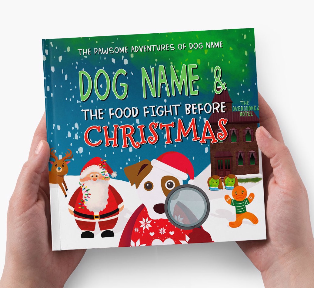 Your Dog's Adventures The Food Fight Before Christmas - Hands holding Cover