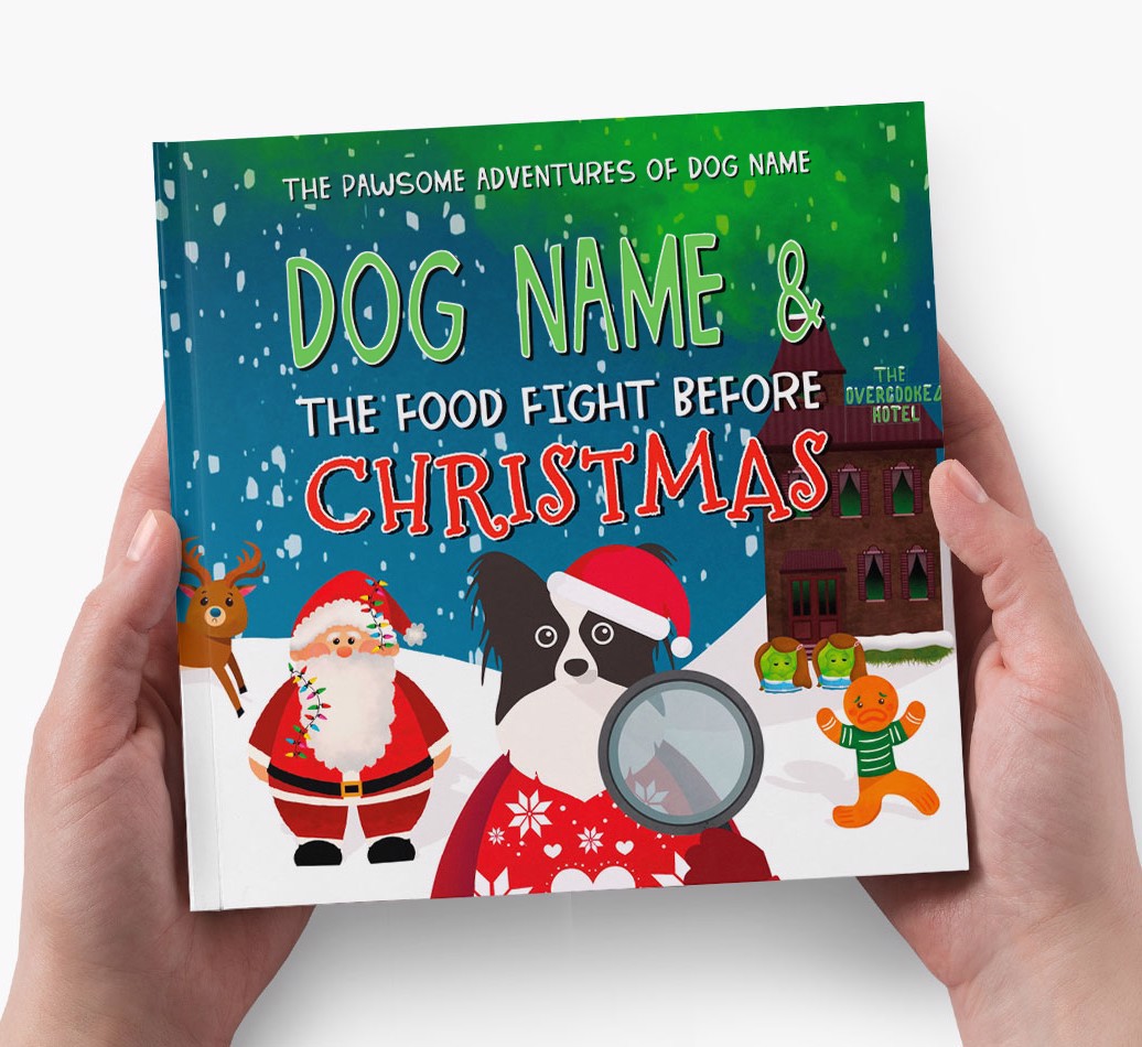 Your Dog's Adventures The Food Fight Before Christmas - Hands holding Cover