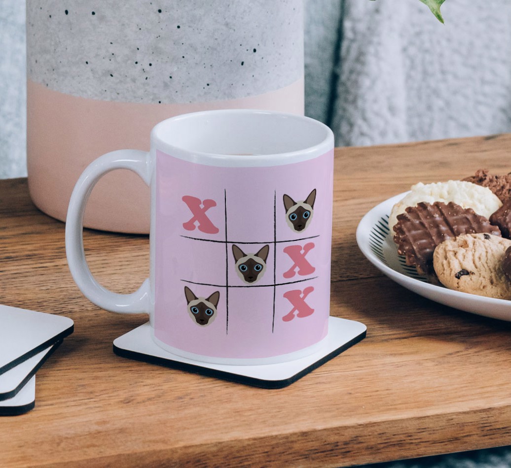 Noughts and Crosses: Personalized {breedCommonName} Mug - on a coffee table