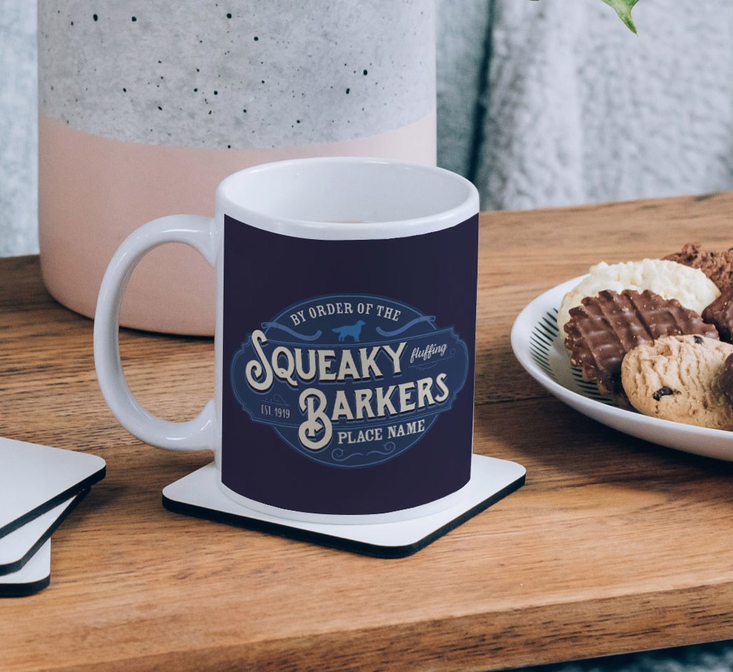 Squeaky Barkers: Personalised {breedCommonName} Mug - on a coffee table