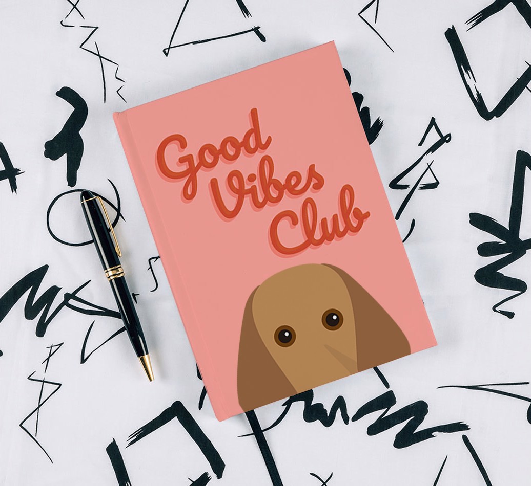 Good Vibes Club: Personalised {breedFullName} Notebook - with pen on black & white pattern background