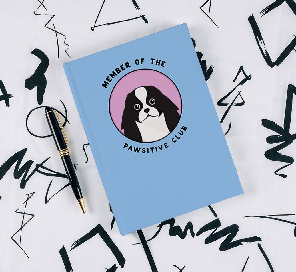 Member of the Pawsitive Club: Personalised {breedCommonName} Notebook - with pen on black & white pattern background