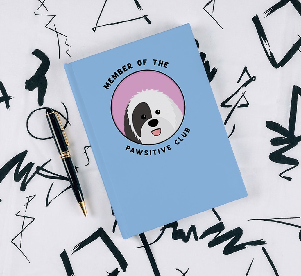 Member of the Pawsitive Club: Personalised {breedCommonName} Notebook - with pen on black & white pattern background