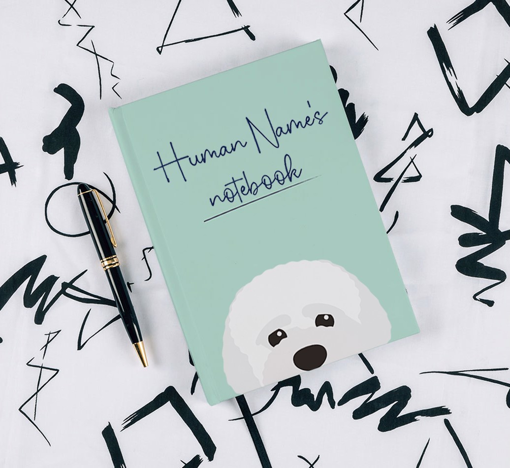 Handwritten: Personalised {breedFullName} Notebook - with pen on black & white pattern background