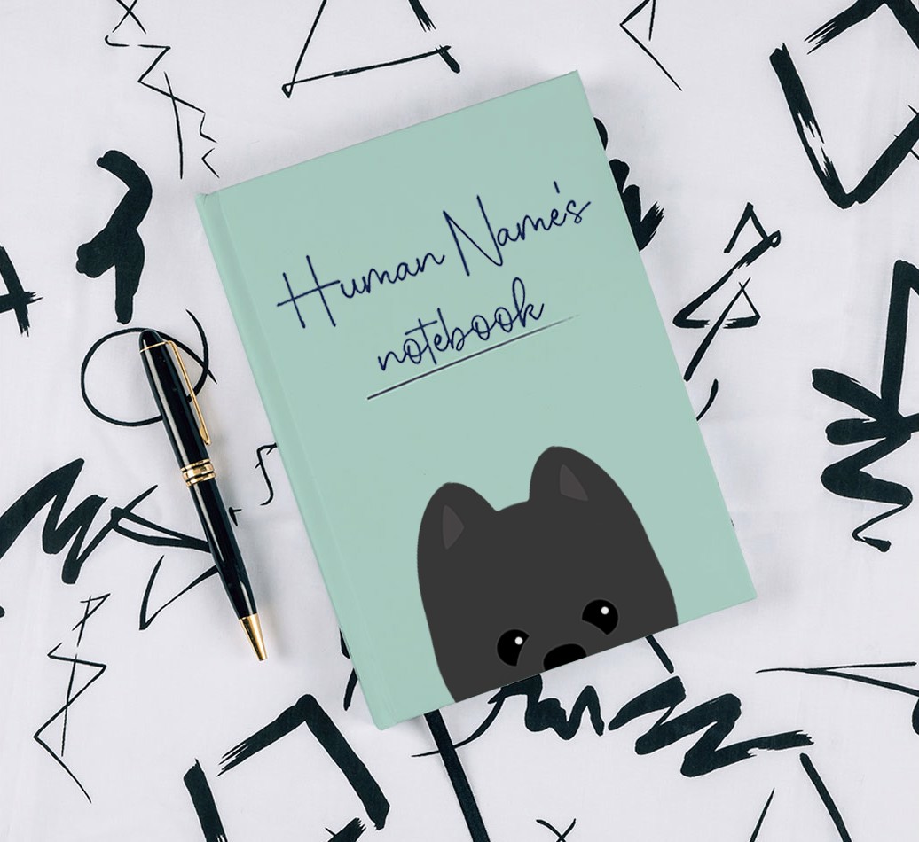 Handwritten: Personalised {breedFullName} Notebook - with pen on black & white pattern background