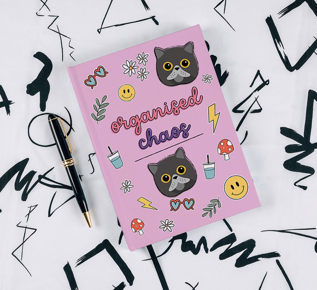 Organised Chaos: Personalised {breedCommonName} Notebook - with pen on black & white pattern background