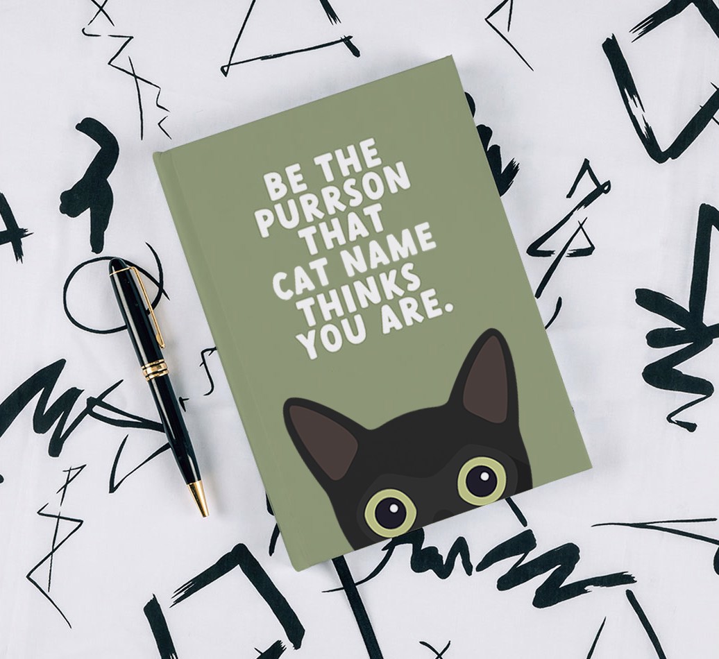 Be The Purrson: Personalised {breedCommonName} Notebook - with pen on black & white pattern background