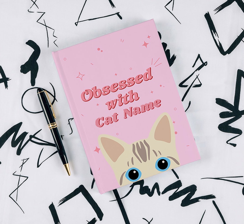 Obessed With: Personalised {breedCommonName} Notebook - with pen on black & white pattern background