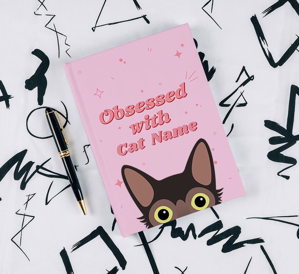 Obessed With: Personalised {breedCommonName} Notebook - with pen on black & white pattern background