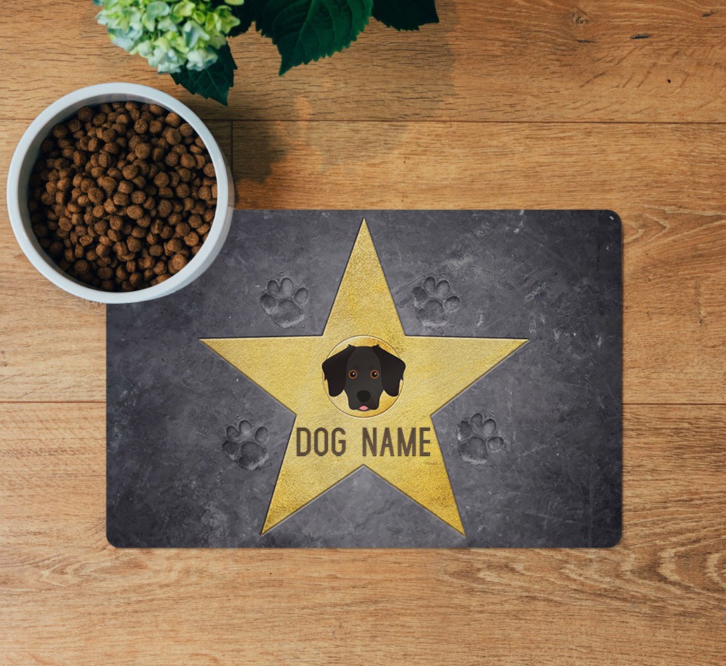 Star of Fame: Personalized {breedFullName} Feeding Mat - layed flat on wooden floor with bowl