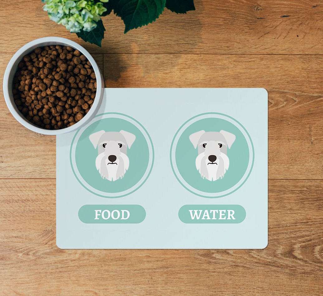Yappicons: Personalised {breedFullName} Feeding Mat - layed flat on wooden floor with bowl