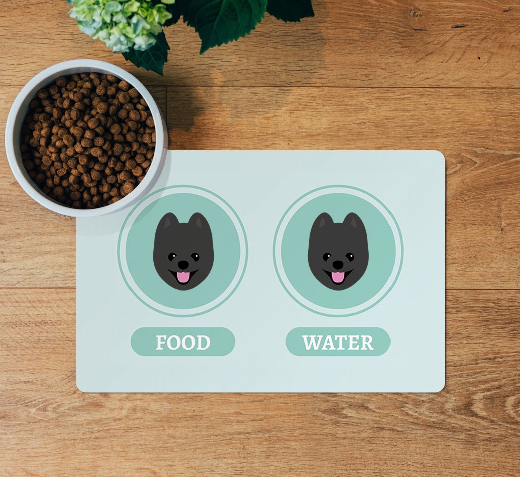 Yappicons: Personalized {breedFullName} Feeding Mat - layed flat on wooden floor with bowl
