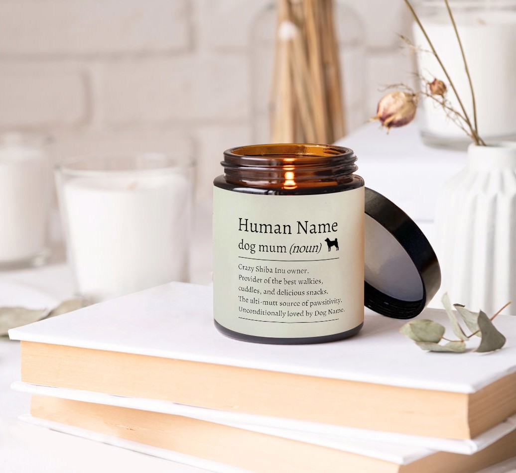 Definition of a Dog Mum: Personalised Candle - on books on a bedside table