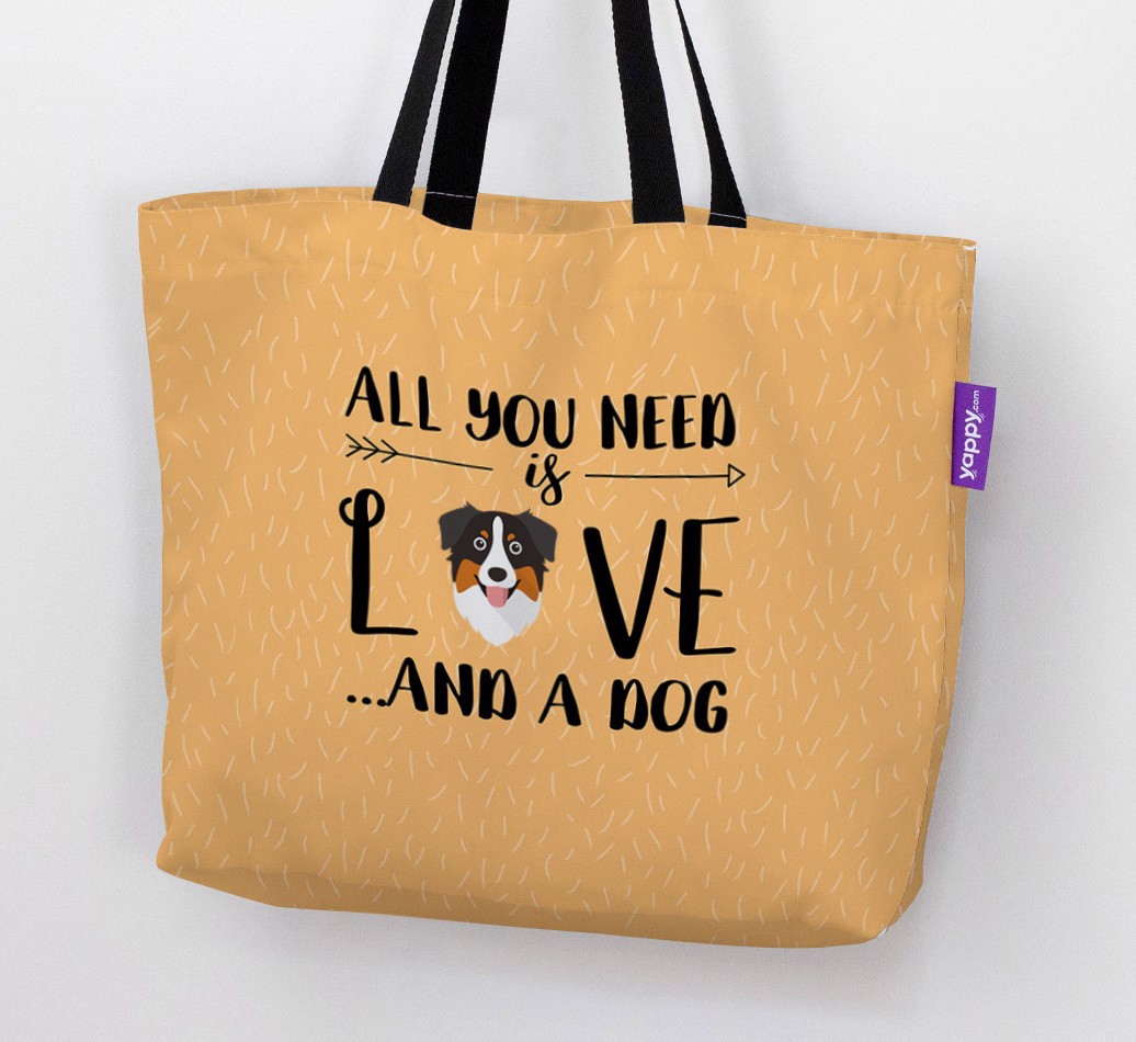 Woman holding 'All You Need Is Love...' - Personalized {breedFullName} Canvas Bag