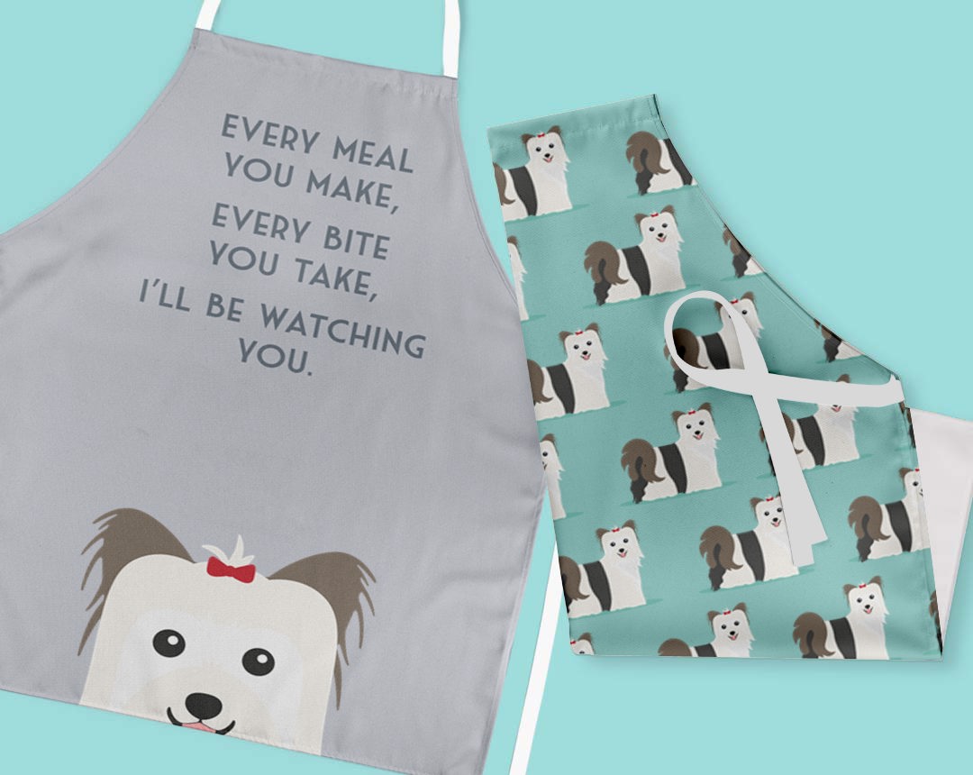 Two personalised aprons featuring personalised dog designs