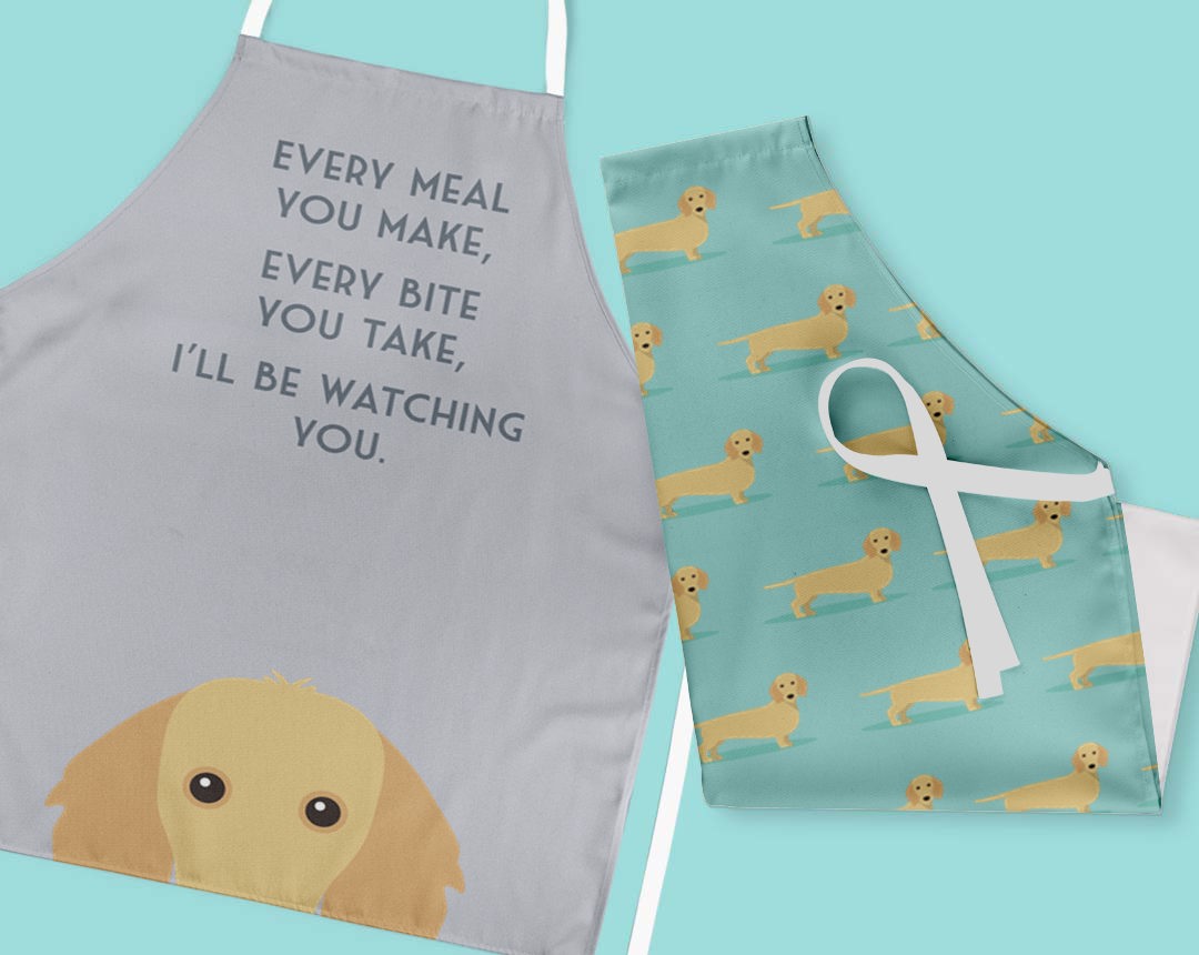 Two personalised aprons featuring personalised dog designs