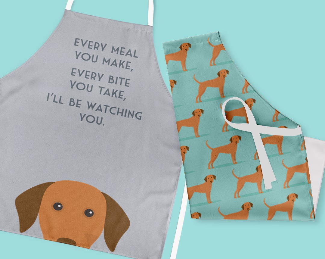 Two personalised aprons featuring personalised dog designs