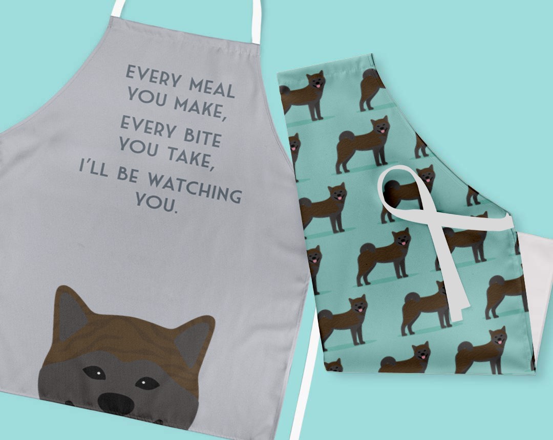 Two personalised aprons featuring personalised dog designs