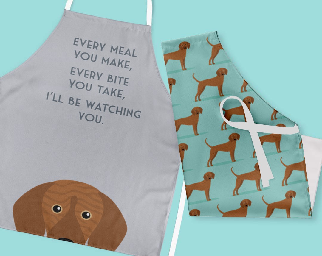 Two personalised aprons featuring personalised dog designs