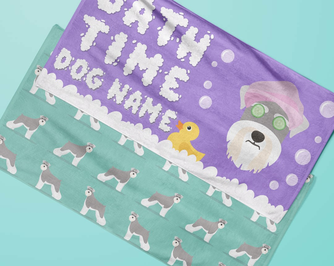 Two towels laying flat with personalised dog designs