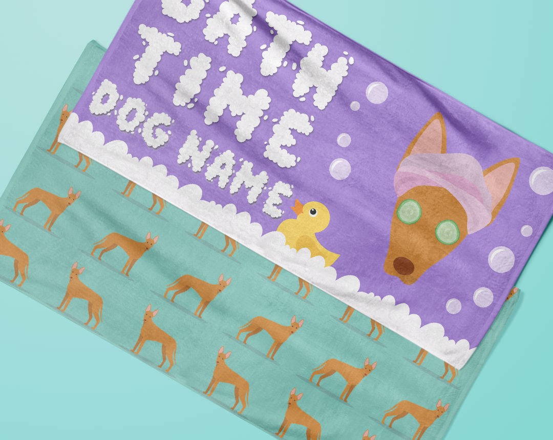 Two towels laying flat with personalised dog designs