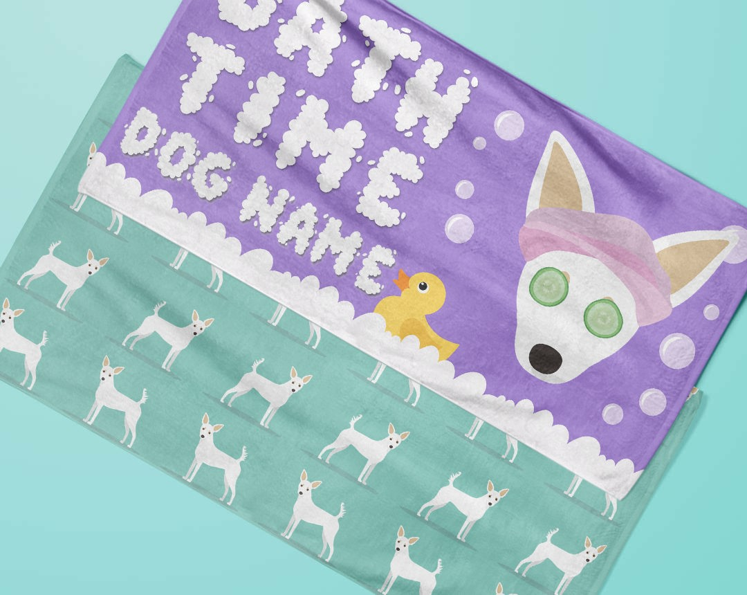 Two towels laying flat with personalised dog designs